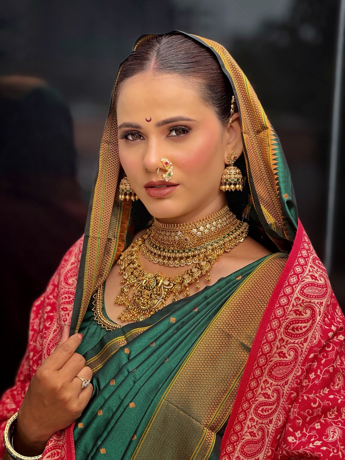 Traditional Maharashtrian look in a teal saree with a nath and pearl jewellery