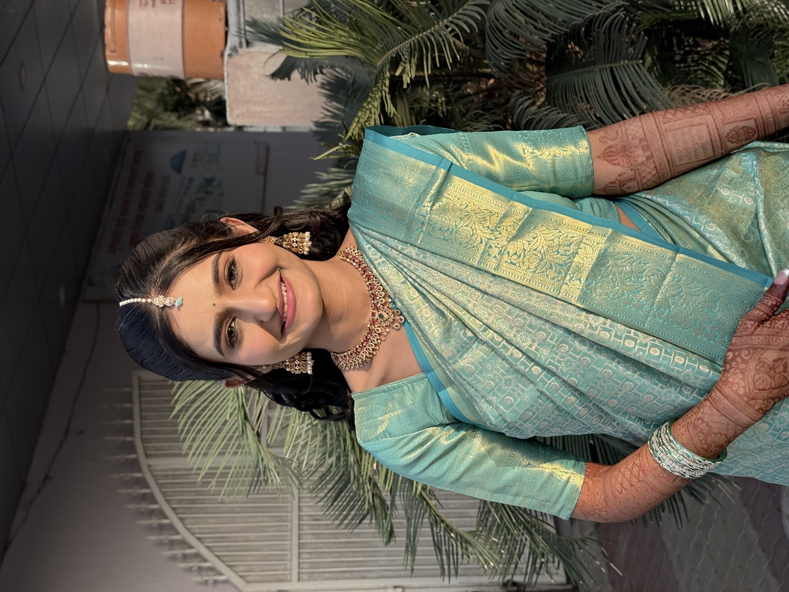 Guest glam look in a teal silk saree